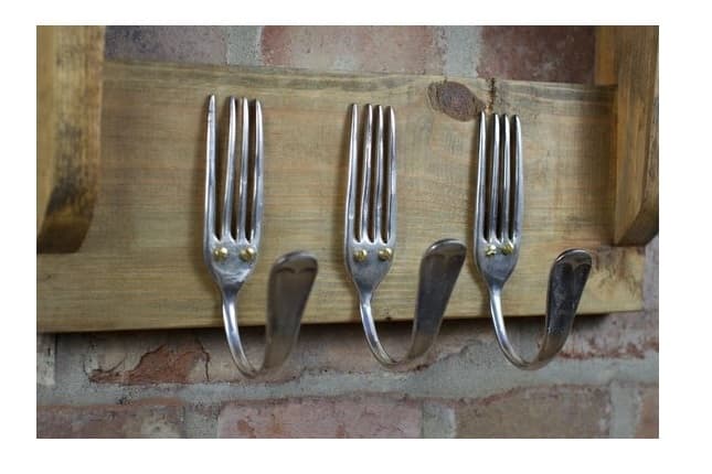 Used wooden Board and 2 forks perfect display of recycled furniture 