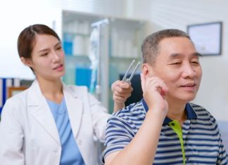 Top Tools That Make Ear Cleaning Easier A healthcare professional assisting a patient with ear cleaning, highlighting the importance of safe and effective tools for maintaining ear hygiene