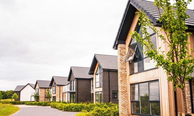 Eco-Friendly Features for Upscale Residences A row of upscale residences featuring eco-friendly design elements like energy-efficient windows and sustainable landscaping, promoting a greener lifestyle