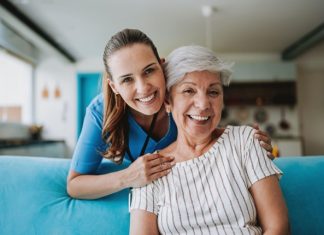 The Essential Guide to Home Care Services: Supporting Independence at Any Age A Nurse and Her Client Smiling