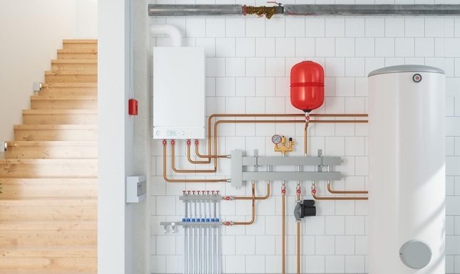 Expert Tips for Seamless Hot Water Tank Installation Neatly installed hot water system with efficient piping, demonstrating seamless setup techniques by TipTop Plumbing and Heating