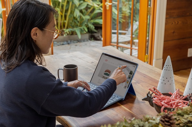 Businesswoman using an AI enablement platform on a tablet device