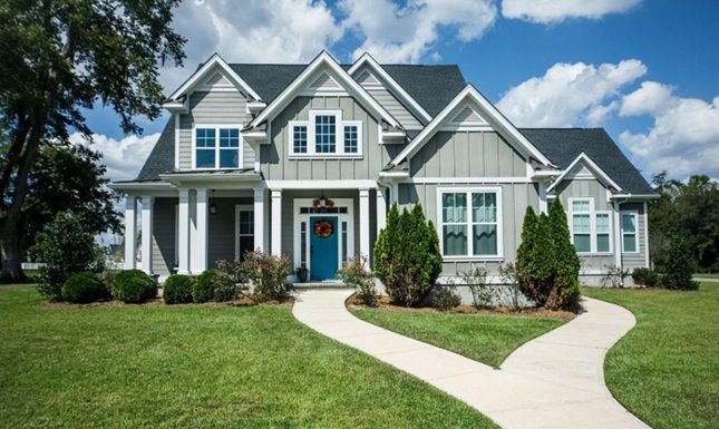 Boosting Curb Appeal and Efficiency with Expert Exterior Renovations in Calgary Charming house with recent exterior renovations, showcasing durable materials and enhanced exterior design