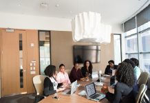 The Benefits of Using Bid and Proposal Management Software for Streamlining the Bidding Process A group of professionals using bid and proposal management software to enhance accuracy and consistency in their proposals.