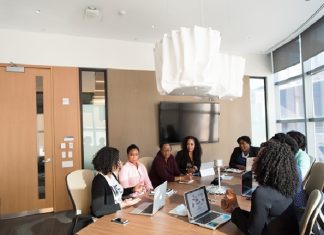 The Benefits of Using Bid and Proposal Management Software for Streamlining the Bidding Process A group of professionals using bid and proposal management software to enhance accuracy and consistency in their proposals.